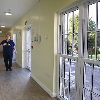 Walking down the sunlight corridor at Cartref Bryn yr Eglwys