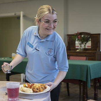 Serving food at Cartref Bryn yr Eglwys