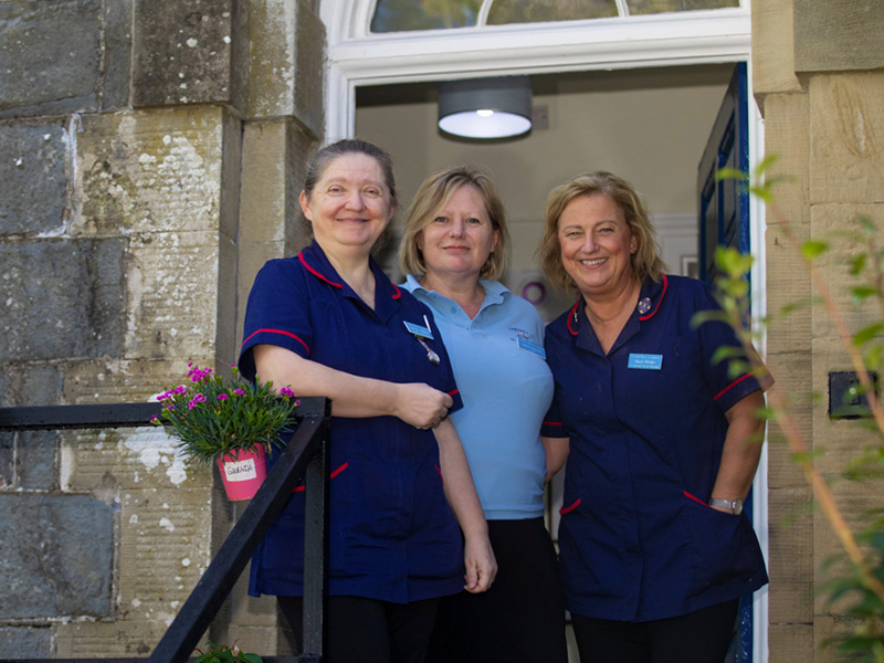 Meryl, Gabi and Helen standing outside the main entrance of Cartref Bryn yr Eglwys.